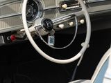 a car dashboard with a steering wheel and a dash board