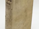 an old book sitting on top of a table next to a white background