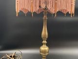 an image of a table lamp with a pink shade on top of it