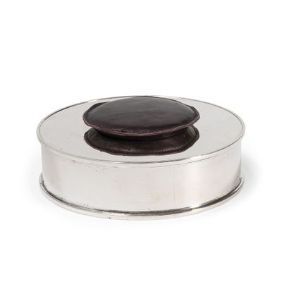 an image of a silver plate with a chocolate covered cookie in it