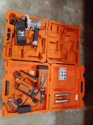 two orange boxes with tools in them on the floor