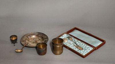 a silver plate and a silver spoon and a silver plate and a silver spoon and a silver plate and a silver spoon and a silver plate and a silver