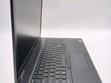 a laptop computer sitting on top of a white table