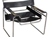 the chair is black and has a metal frame and leather seat