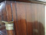 a wooden cabinet with a marble top and a marble top top