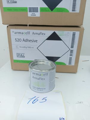 two boxes of empty cans sitting on top of a white table