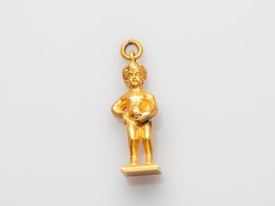 a gold figurine of a man holding a baby in his arms