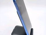 a cell phone that is sitting on top of a stand