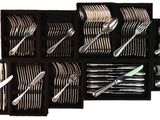 a lot of forks and spoons in a black box