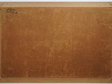 an old brown piece of luggage sitting on top of a white surface