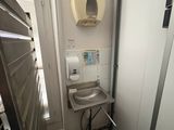 someone is taking a picture of a bathroom with a toilet and sink