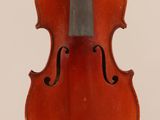 an old violin with a bow hanging from it ' s back