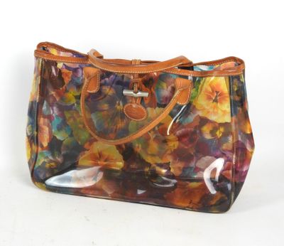 sac à main transparent à motif floral et anses en cuir, sur fond blanc