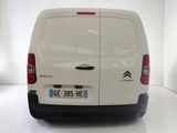 a white van that is parked in a white room