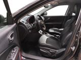 the interior of a car with the door open and the driver ' s seat down