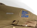 a military uniform with a badge on it
