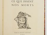 an old book with a drawing of a woman in a dress