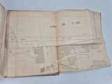 an old book with a map of a city on it