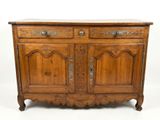 an old wooden cabinet with two doors and a drawer on top