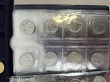 a lot of coins that are in a case