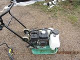 an image of a lawn mower that is sitting on the ground