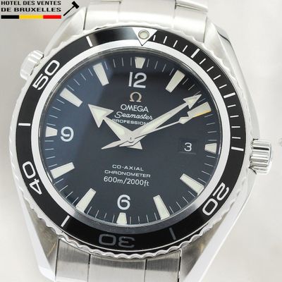 a close up of a watch with a black dial