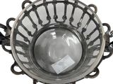 a glass bowl that has a light inside of it