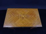 a wooden box with a design on the inside of it