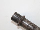 a metal pipe with a hole in it on a white surface