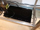 an image of a stove top with a water bottle on it