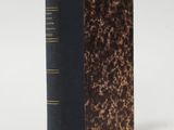 a close up of a book on a white surface with a white background