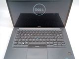 laptop computer with dell logo on screen sitting on white surface