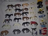 a lot of horse figurines that are on the table