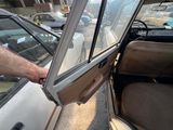 a man that is opening the door of a car