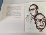 an open book with a drawing of a man and a woman