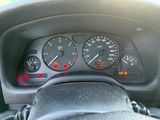 a close up of a car dashboard with a speedometer and gauges