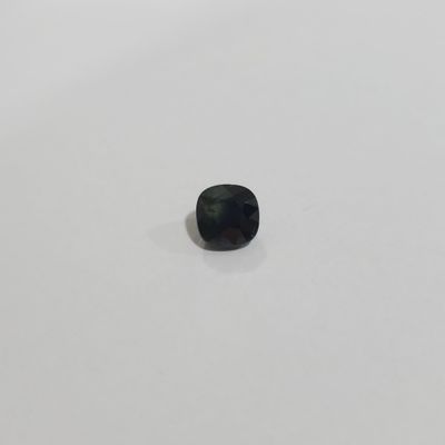 a square black diamond on a white surface