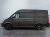 a grey van that is parked in a parking lot