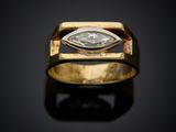 a close up of a gold ring with a diamond in the center