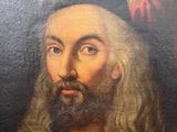 painting of a man with a beard and a red hat