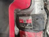 an image of a close up of a drill on a table