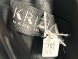 the label on the back of a black jacket