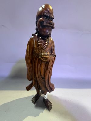 a statue of a man that is standing on a table