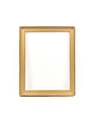 a gold picture frame on a white wall with a white background
