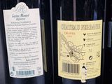 several bottles of wine are lined up on a shelf