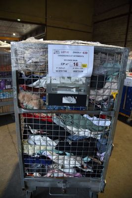 a cart with many items in it in a warehouse