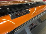 a close up of a car ' s dashboard with a sticker on it