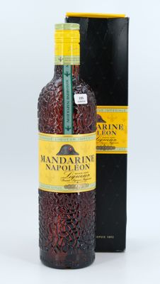 a close up of a bottle of wine next to a box