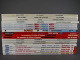 many books stacked on top of each other on a table