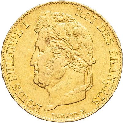 a close up of a gold coin with a head of a man
